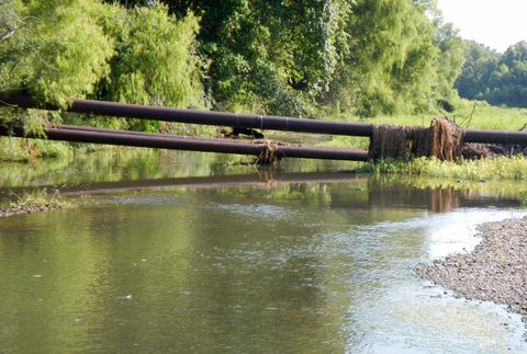 You will have to duck low or go around. Not too bad though, unless the water was higher.